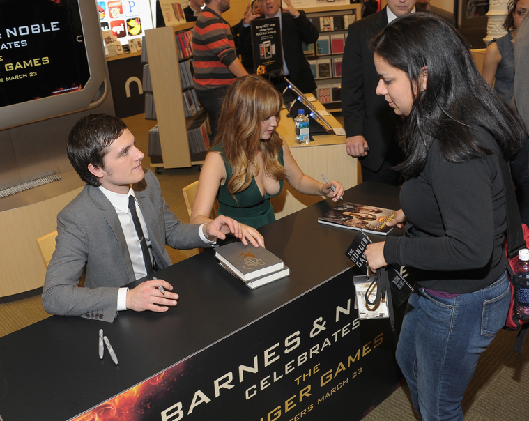 Jennifer_Lawrence_wearing_a_cute_low_cut_green_dress_at_a_book_signing_for_The_Hunger_Games_57.jpg