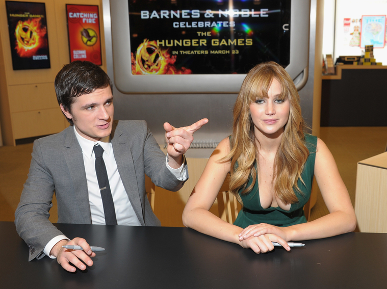 Jennifer_Lawrence_wearing_a_cute_low_cut_green_dress_at_a_book_signing_for_The_Hunger_Games_58.jpg