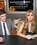 Jennifer_Lawrence_wearing_a_cute_low_cut_green_dress_at_a_book_signing_for_The_Hunger_Games_58.jpg