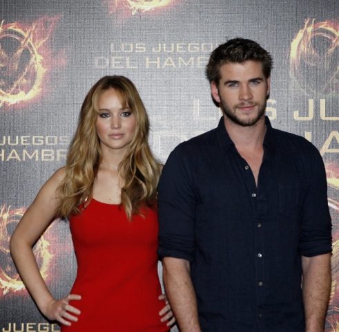 Jennifer Lawrence wearing a sexy HOT red dress very similar to the famous one she wore to the 2011 Oscars. 
