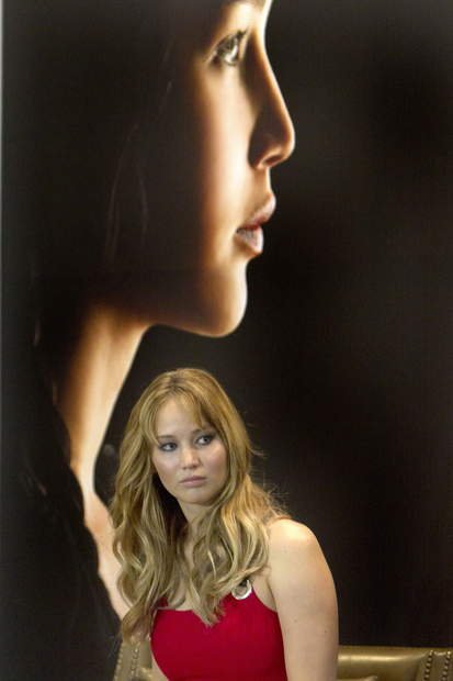 Jennifer Lawrence wearing a sexy HOT red dress very similar to the famous one she wore to the 2011 Oscars. 
